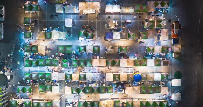 Food fair, festive food, street food or flea market in aerial view. Many people, booth tent, shop, vendor and food stall. Festival in Tha Sala sub district, Amphur Donjan, Chiang Mai, Thailand.