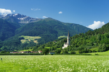 Mountain landscape in the Venosta valley at summer. Church