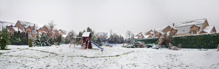 Snow covered yard in a beautiful neigborhood in Bucharest.Christmas landscape