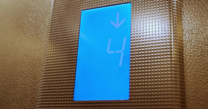 The display with numbering floors in the elevator. Slow motion