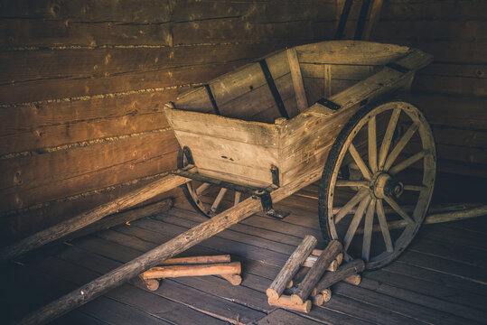 Old vintage wooden cart a barn. Traditional wooden cart