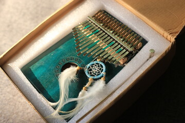 Unbox of Kalimba or mbira is an African musical instrument.Traditional small Kalimba made from ...