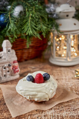 Cake decorated with blackberries and raspberries on the christmas table
