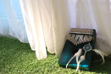 Kalimba or mbira is an African musical instrument.Traditional small Kalimba made from  wooden board...