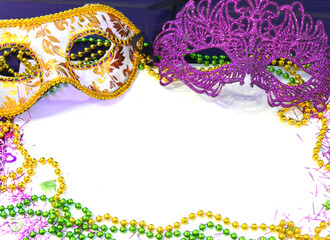 Mardi gras mask and beads frame for text on white space background. Madi gras celebration fat...