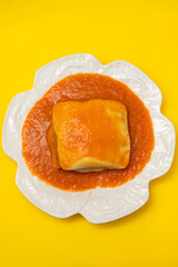 typical Portuguese food Francesinha in white dish