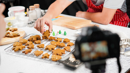 Obraz na płótnie Canvas Online bakery course produciton for cookies homemade cooking for Christmas traditional dessert. Kids and family love to prepare to make dough and bake them. Learn from video as new normal life