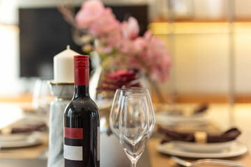 Red wine with wine glasses on the table at home.