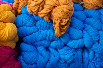 View of the blue and orange color thread yarns used in textile industry