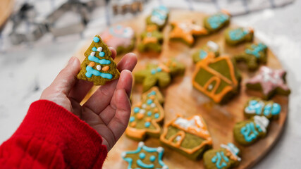 Green ginger bread cookies homemade cooking for Christmas traditional dessert. Kids and family love to prepare green tea cookies. Celebration cookies for Christmas.