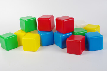 Colored plastic cubes for children's play on a light.