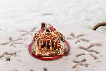 Ginger bread in the backyard covered with snow.Christmas time in Bucharest