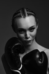 portrait of glamour female boxer looking at the camera. fashion sexy gorgeous woman model in black...