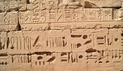 Fototapeta na wymiar Ancient Egyptian writing, Egyptian hieroglyphs, wall inscriptions