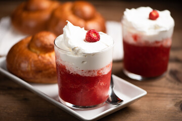 A delicious breakfast with strawberry granita and brioches, sicily