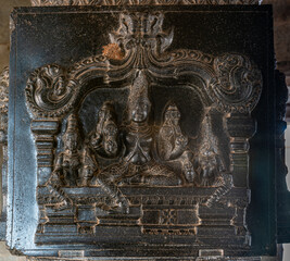 Hampi, Karnataka, India - November 4, 2013: Hazara Rama Temple. Black marble fresco of Vishnu with...