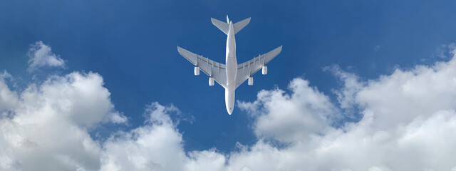 Zoom photo of passenger airplane taking off in deep blue  slightly cloudy sky as seen from the...