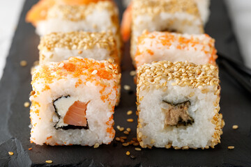 Fresh sushi closeup on black stone board