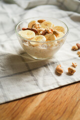 Overnight oats in bowl. Healthy breakfast. Low sugar diet. Vertical orientation 