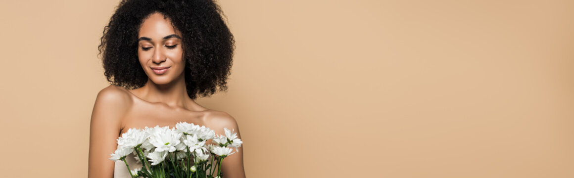 Happy African American Woman Holding Flowers Isolated On Beige, Banner