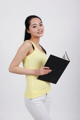 A young beauty lady holding a book 