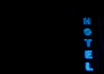 Hotel neon sign, copy space