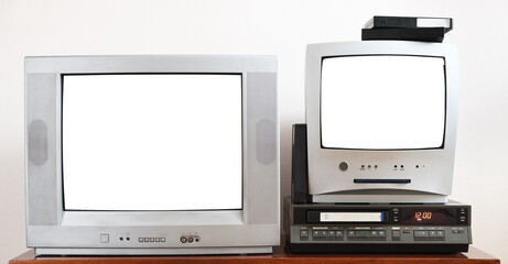 Two old silver TVs with white screens for video and photos with built-in DVD player and vintage video recorder from 1980s, 1990s, 2000s.