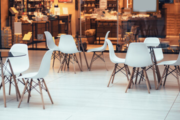 lot of empty tables in the restaurant hall
