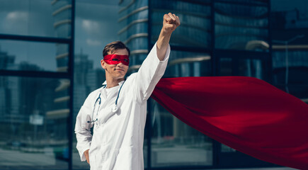 confident doctor in a superhero Cape is ready for feats.