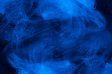 Blue steam on a black background.