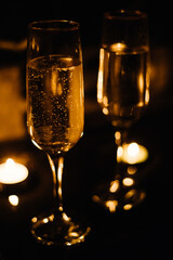 Celebration.Glasses of wine. The concept of Valentine's Day. Bokeh in the background of glasses are shaped like heart.