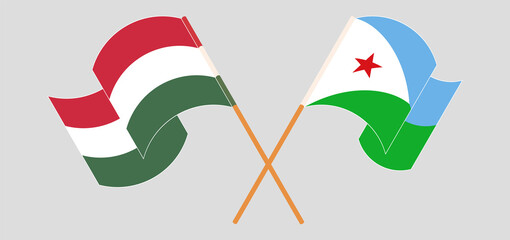 Crossed and waving flags of Hungary and Djibouti