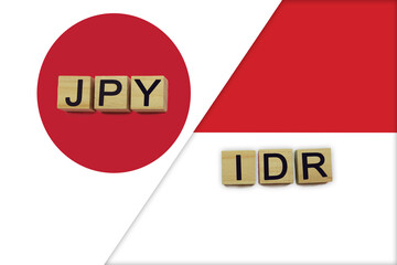 Japan and Indonesia currencies codes on national flags background