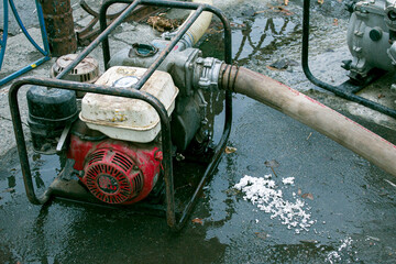 Flood pumping system. The pond in the park overflowed its banks. The municipal authorities...