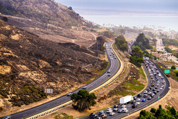 Hillside, freeway clogged with Cars