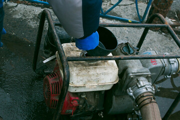 Flood pumping system. The pond in the park overflowed its banks. The municipal authorities...