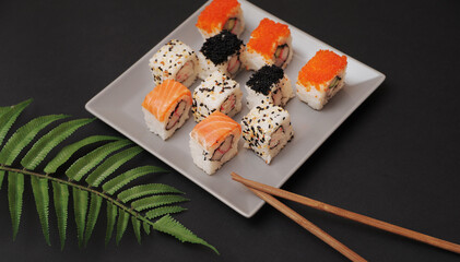 Set of rolls in plate on grey background.