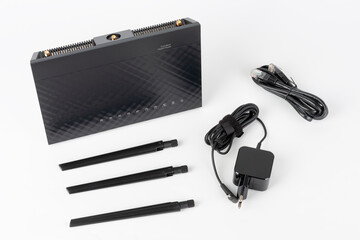 Wifi router , power cable, network cable, three antennas. Wireless device on white background.