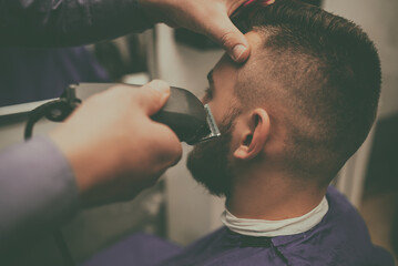 Hipster client visiting barber shop
