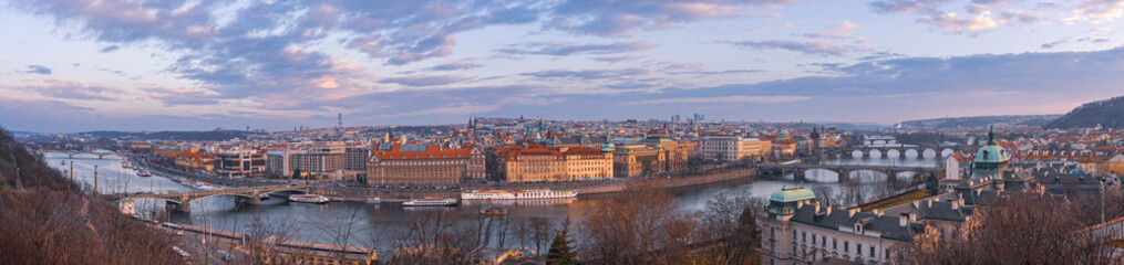 Obraz premium Beautiful spring sunset over the old city of Prague with wide angle view Vltava river