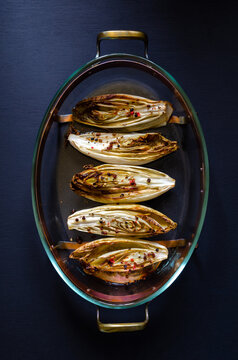 Overhead vieuw of oven baked chicory of endives on a fire fixed dish,casserole. 