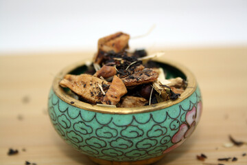 Fototapeta na wymiar Black tea infused with various herbs.