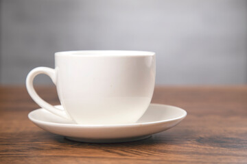 cup of coffee on the wooden background