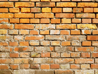 Old vintage red brick wall with falling plaster white texture background