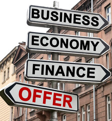 The road indicator on the arrows of which is written - business, economics, finance and OFFER
