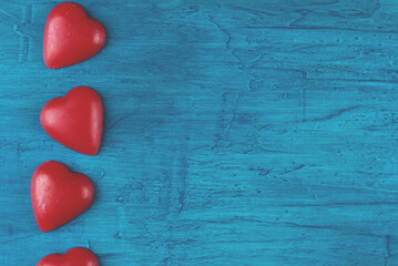 Red hearts on blue background.