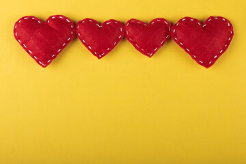 Red hearts on yellow background.