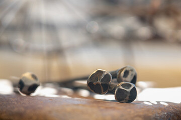 Close up bloody nails against bloor image of crown of thorns as symbol of passion of Jesus Christ..