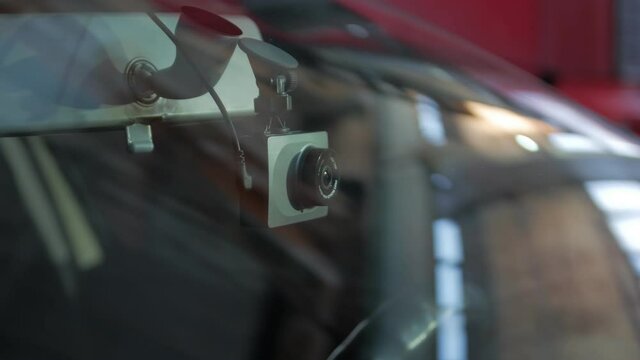 Car dash cam recorder view through the windshield camera movement