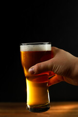 glass of beer in hand